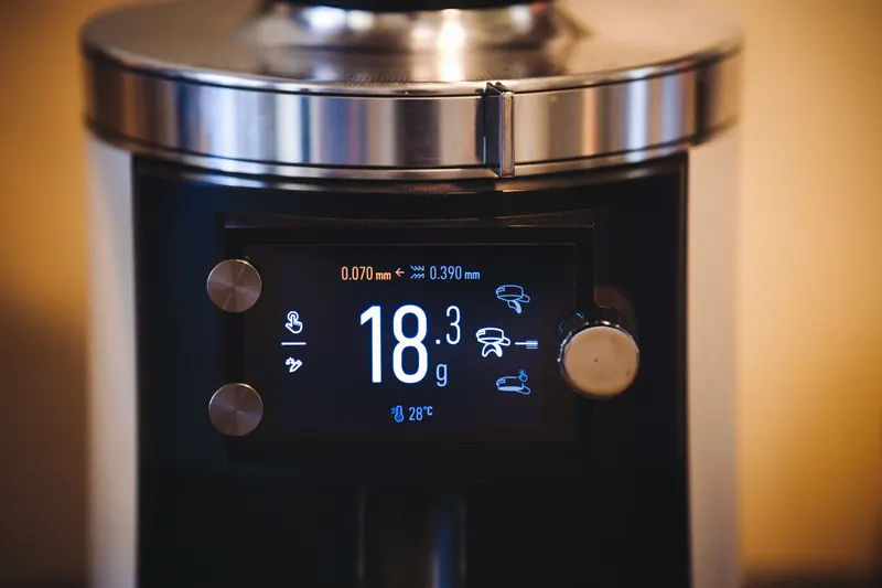 A modern coffee grinder with digital display showing measurements, ideal for baristas